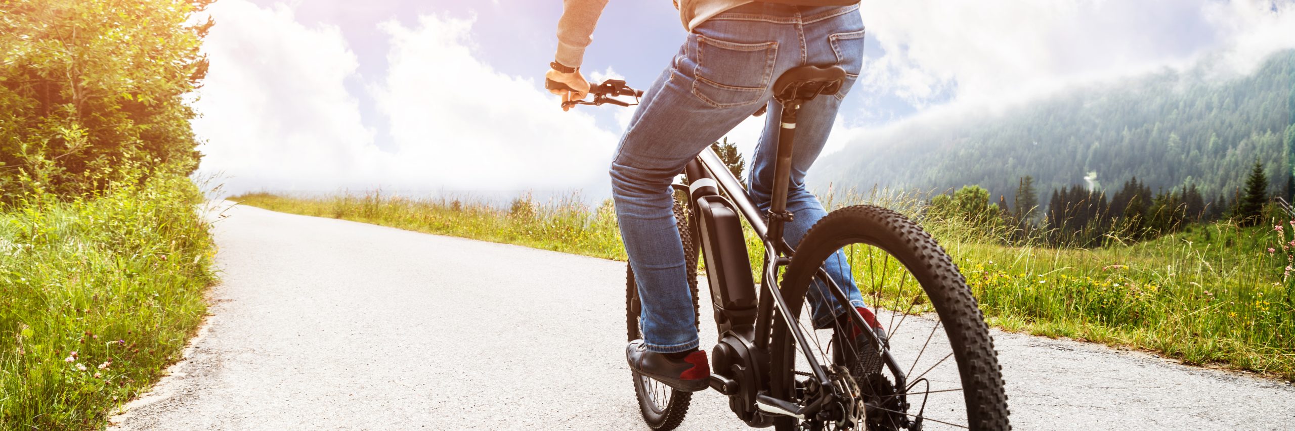 Man,Riding,Electric,Mountain,Bike,In,Alps